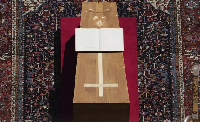 The book of the Gospels lies on the coffin of Pope Francis during his funeral ceremony in St. Peter's Square at the Vatican, Saturday, April 26, 2025. (AP Photo/Alessandra Tarantino)