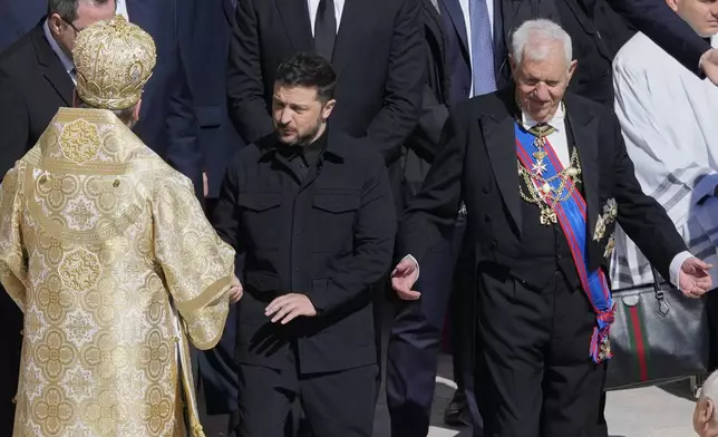 Ukraine's President Volodymr Zelenskyy, center, arrives for the funeral of Pope Francis in St. Peter's Square at the Vatican, Saturday, April 26, 2025. (AP Photo/Gregorio Borgia)