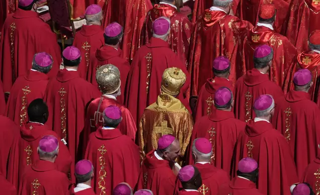 Cardinals stand during the funeral of Pope Francis in St. Peter's Square at the Vatican, Saturday, April 26, 2025. (AP Photo/Gregorio Borgia)
