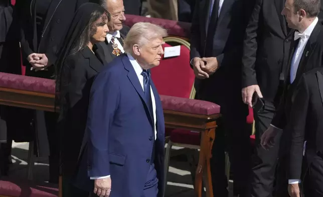 President Donald Trump and first lady Melania Trump arrive for the funeral of Pope Francis in St. Peter's Square at the Vatican, Saturday, April 26, 2025. (AP Photo/Markus Schreiber)