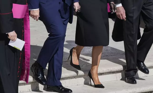President Donald Trump and first lady Melania Trump, center, arrive for the funeral of Pope Francis in St. Peter's Square at the Vatican, Saturday, April 26, 2025. (AP Photo/Gregorio Borgia)