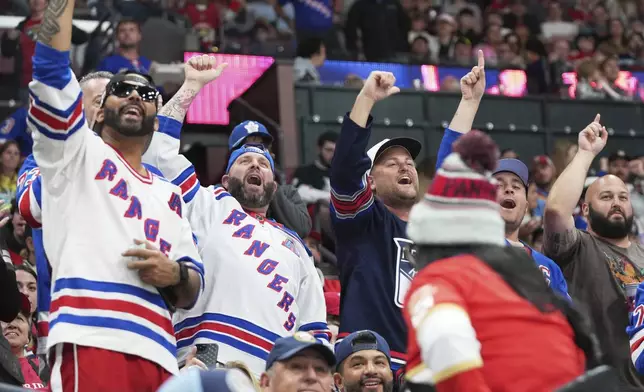 New York Rangers fans during the second period of an NHL hockey game against the Florida Panthers, Monday, April 14, 2025, in Sunrise, Fla. (AP Photo/Lynne Sladky)