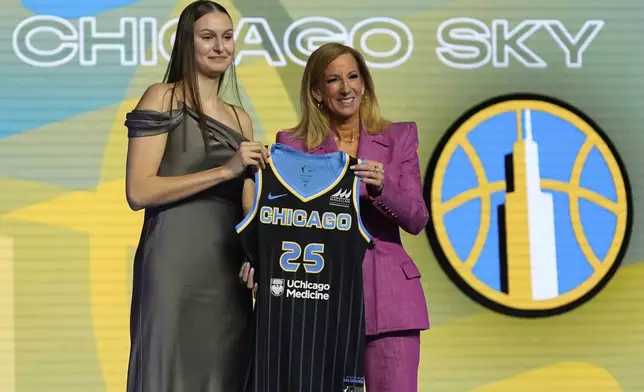 Ajsa Sivka, left, poses for a photo with WNBA commissioner Cathy Engelbert after being selected 10th overall by the Chicago Sky during the first round of the WNBA basketball draft, Monday, April 14, 2025, in New York. (AP Photo/Pamela Smith)