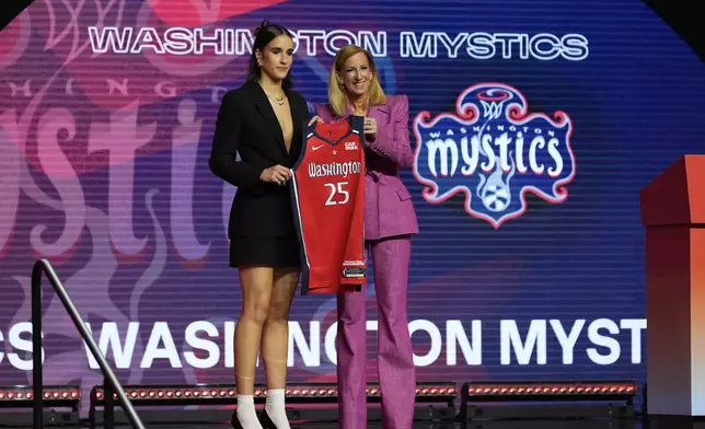 Notre Dame's Sonia Citron, left, poses with WNBA commissioner Cathy Engelbert after being selected third overall by the Washington Mystics during the first round of the WNBA basketball draft, Monday, April 14, 2025, in New York. (AP Photo/Pamela Smith)
