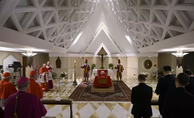 Pope Francis's body is laid out in state inside his private chapel at the Vatican, Monday, April 21, 2025. From left, Dean Cardinal Giovanni Battista Re, unidentified bishop, Secretary of State Pietro Parolin, Master of Ceremonies Archbishop Diego Giovanni Ravelli, Cardinal Camerlengo Kevin Joseph Farrell, and Master of Ceremonies Lubomir Welnitz. (Vatican Media via AP, HO)