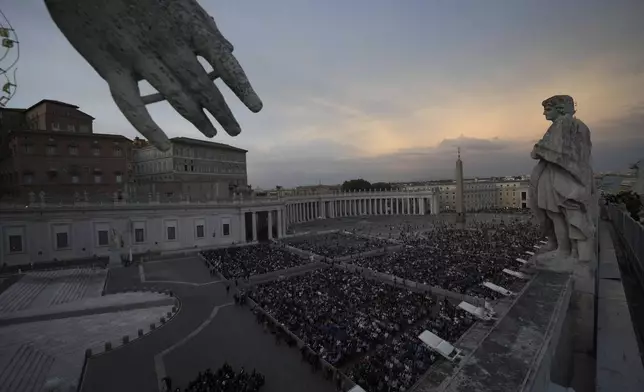 Faithful gather for a rosary prayer for the late Pope Francis, in St. Peter's Square at the Vatican, Monday April 21, 2025. (AP Photo/Andrew Medichini)