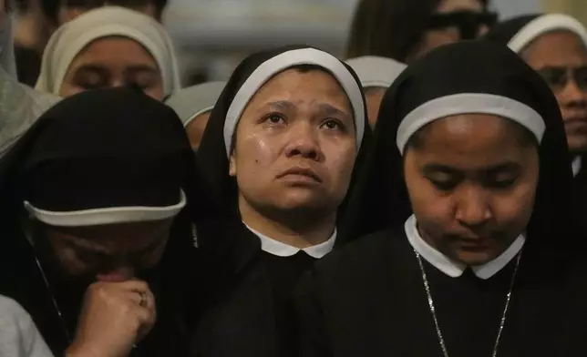 Nuns attend a Mass for the late Pope Francis, at the St. John Lateran Basilica, in Rome, Monday April 21, 2025. (AP Photo/Gregorio Borgia)