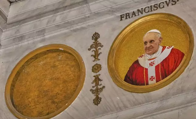 An icon of Pope Francis at the Saint Paul Outside the Walls Basilica in Rome, Tuesday April 22, 2025. (AP Photo/Gregorio Borgia )