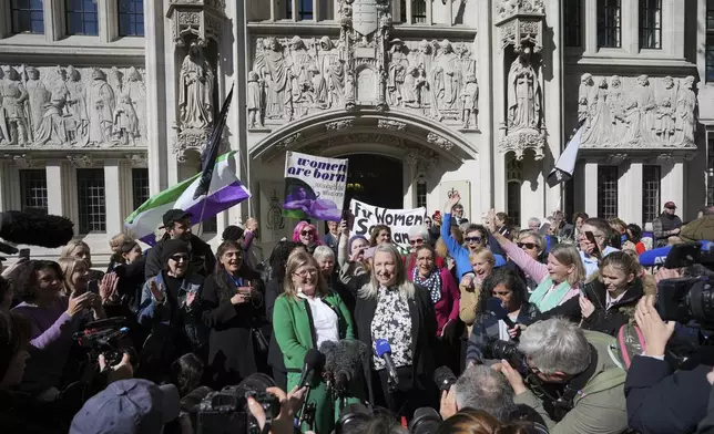 Marion Calder and Susan Smith from For Women Scotland, celebrate outside the Supreme Court to challenge gender recognition laws, in London, Wednesday, April 16, 2025. (AP Photo/Kin Cheung)