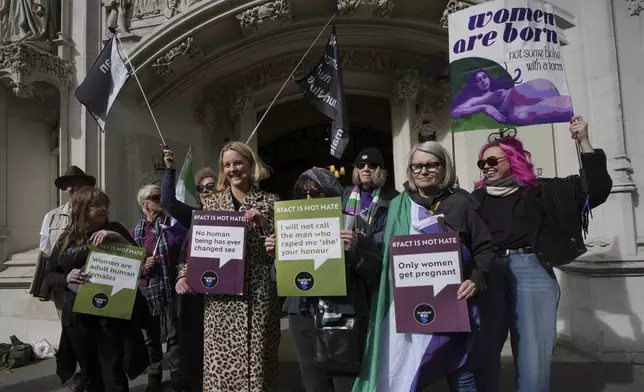 Women's rights activists celebrate outside the Supreme Court to challenge gender recognition laws, in London, Wednesday, April 16, 2025. (AP Photo/Kin Cheung)