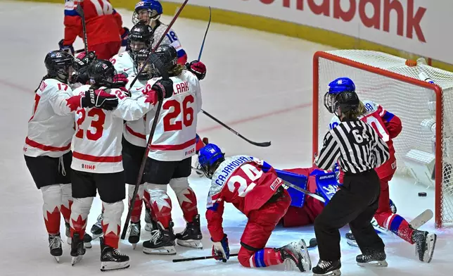 Canadian players celebrate their fifth goal during the IIHF Women's World Championship, Group A, match between Czech Republic and Canada, in Ceske Budejovice, Czech Republic, Monday, April 14, 2025. (Vaclav Pancer/CTK via AP)