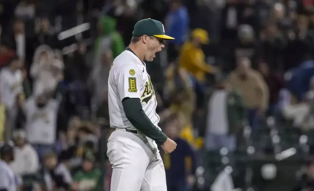 Athletics pitcher Mason Miller (19) reacts as he walks off the mound after a baseball game against the Chicago White Sox, Friday, April 25, 2025, in West Sacramento, Calif. (AP Photo/Sara Nevis)