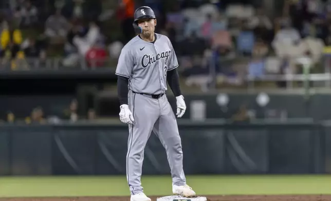Chicago White Sox's Matt Thaiss reacts toward third base coach Justin Jirschele after hitting an RBI double during the sixth inning of a baseball game against the Athletics, Friday, April 25, 2025, in West Sacramento, Calif. (AP Photo/Sara Nevis)