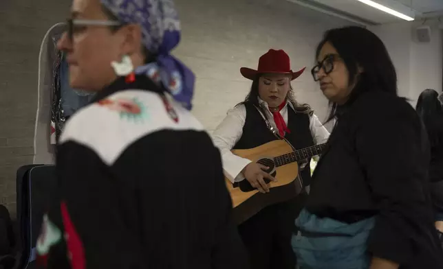 Mexican corridos singer Vivir Quintana prepares to perform her new album, about violence against women, in Mexico City, Thursday, April 24, 2025. (AP Photo/Aurea Del Rosario)