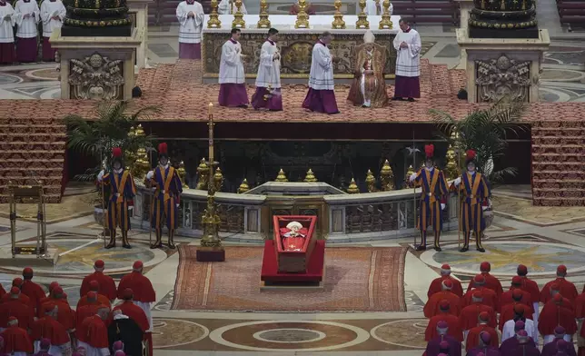 The body of Pope Francis lies inside St. Peter's Basilica at the Vatican, Wednesday, April 23, 2025, where he will lie in state for three days. (AP Photo/Andrew Medichini, Pool)