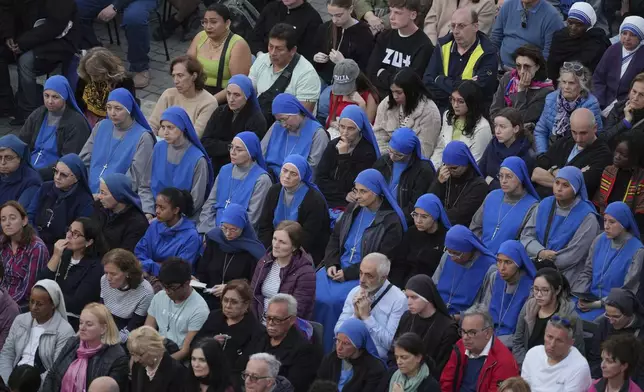 Faithful gather for a rosary prayer for the late Pope Francis, in St. Peter's Square at the Vatican, Monday April 21, 2025. (AP Photo/Andrew Medichini)