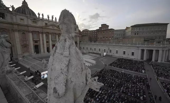 Faithful gather for a rosary prayer for the late Pope Francis, in St. Peter's Square at the Vatican, Monday April 21, 2025. (AP Photo/Andrew Medichini)
