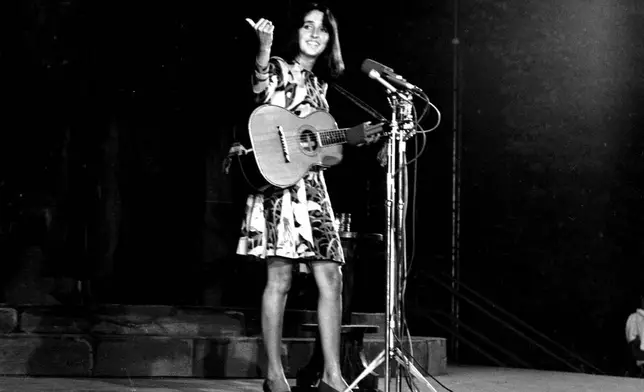 FILE - Folk singer Joan Baez performs at the Washington Monument in Washington, D.C. on Aug. 14, 1967. (AP Photo/ John Rous, File)