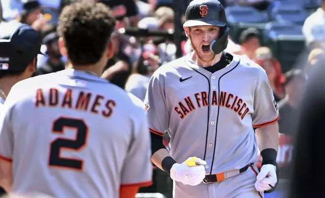 San Francisco Giants catcher Sam Huff (23) celebrates his two-run home run against the Los Angels Angels during the sixth inning of a baseball game Sunday, April 20, 2025, in Anaheim, Calif. (AP Photo/Wally Skalij)