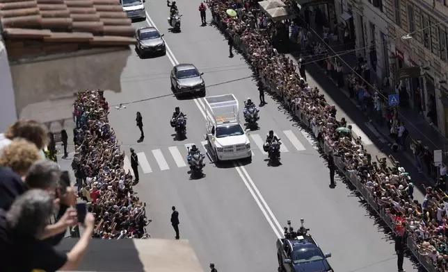 The coffin of Pope Francis makes its way to St. Mary Major Basilica in Rome, Saturday, April 26, 2025. (AP Photo/Luca Bruno)