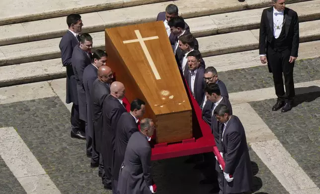The coffin of Pope Francis is carried into St. Mary Major Basilica in Rome, Saturday, April 26, 2025. (AP Photo/Luca Bruno)