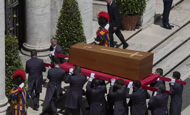 The coffin of Pope Francis is carried inside St. Mary Major Basilica for his burial ceremony, in Rome, Saturday, April 26, 2025. (AP Photo/Antonietta Baldassarre)