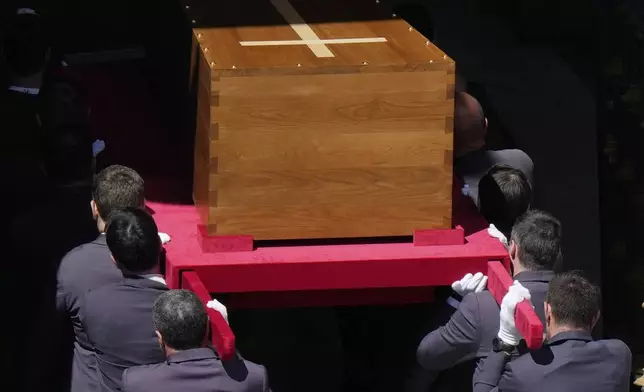 The coffin of Pope Francis is carried into St. Mary Major Basilica in Rome, Saturday, April 26, 2025. (AP Photo/Luca Bruno)