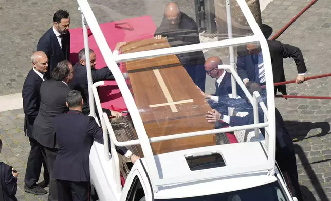 The coffin of Pope Francis arrives at St. Mary Major Basilica in Rome, Saturday, April 26, 2025. (AP Photo/Luca Bruno)