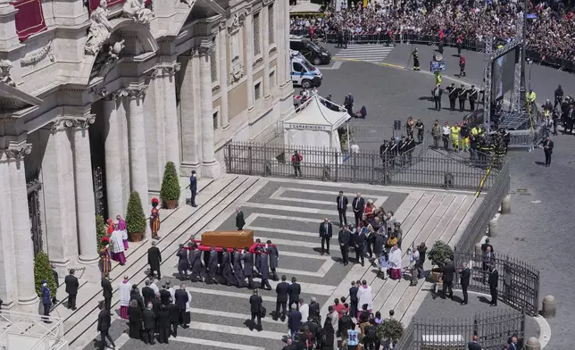 The coffin of Pope Francis is carried inside St. Mary Major Basilica for his burial ceremony, in Rome, Saturday, April 26, 2025. (AP Photo/Antonietta Baldassarre)