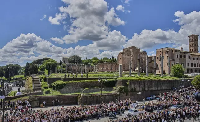 The coffin of Pope Francis passes by on the way to Santa Maria Maggiore in Rome, Saturday, April 26, 2025. (AP Photo/Bernat Armangue)