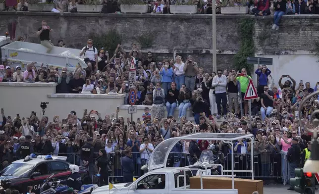 The coffin of Pope Francis leaves St. Peter's Square on its way to St.Mary Major where he will be buried, at the Vatican, Saturday, April 26, 2025. (AP Photo/Gregorio Borgia)