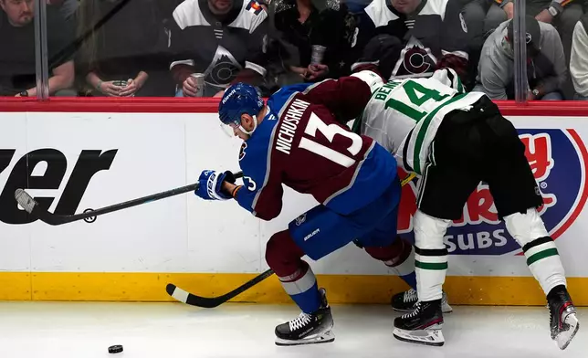 Colorado Avalanche right wing Valeri Nichushkin, right, drives past Dallas Stars left wing Jamie Benn in the first period of Game 3 of an NHL hockey first-round playoff series Wednesday, April 23, 2025, in Denver. (AP Photo/David Zalubowski)