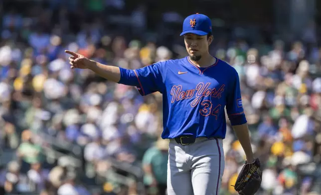New York Mets pitcher Kodai Senga (34) walks to the dugout during the seventh inning of a baseball game Sunday, April 13, 2025, in West Sacramento, Calif. (AP Photo/Sara Nevis)