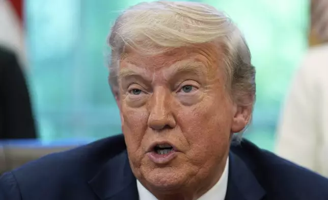 President Donald Trump speaks with reporters after signing executive orders in the Oval Office of the White House, Wednesday, April 23, 2025, in Washington. (AP Photo/Alex Brandon)