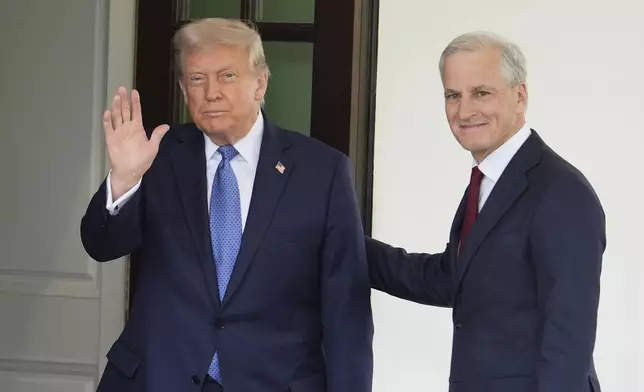 President Donald Trump greets Norwegian Prime Minister Jonas Gahr Støre, upon his arrival at the White House, Thursday, April 24, 2025, in Washington. (AP Photo/Alex Brandon)