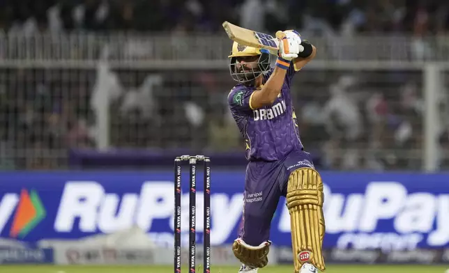 Kolkata Knight Riders' captain Ajinkya Rahane plays a shot during the Indian Premier League cricket match between Kolkata Knight Riders and Lucknow Super Giants at Eden Gardens in Kolkata, India, Tuesday, April 8, 2025. (AP Photo/Bikas Das)