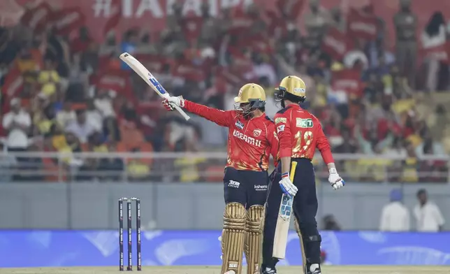 Punjab Kings' Priyansh Arya, left, celebrates after scoring fifty runs during the Indian Premier League cricket match between Punjab Kings and Chennai Super Kings at Maharaja Yadavindra Singh Cricket Stadium in Mohali, India, Tuesday, April 8, 2025. (AP Photo/Surjeet Yadav)