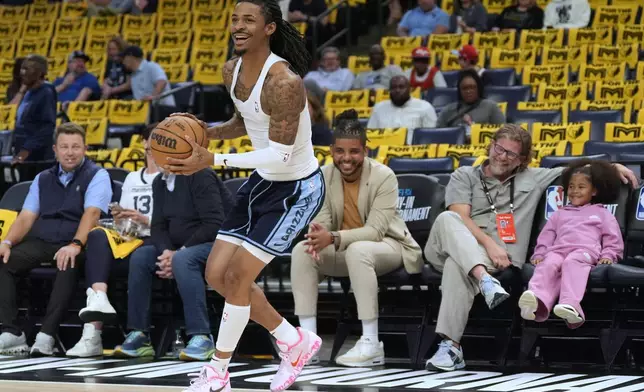 Memphis Grizzlies guard Ja Morant warms up before an NBA play-in tournament basketball game against the Dallas Mavericks, Friday, April 18, 2025, in Memphis, Tenn. (AP Photo/George Walker IV)