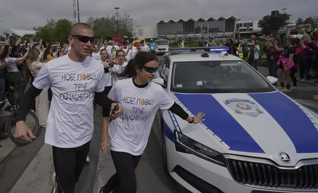 Serbia's protesting students embark on 2,000-kilometer (1,200-mile) run to Brussels aimed to draw European Union attention to their months-long struggle against corruption and for the rule of law in Novi Sad, Serbia, Friday, April 25, 2025. (AP Photo/Darko Vojinovic)