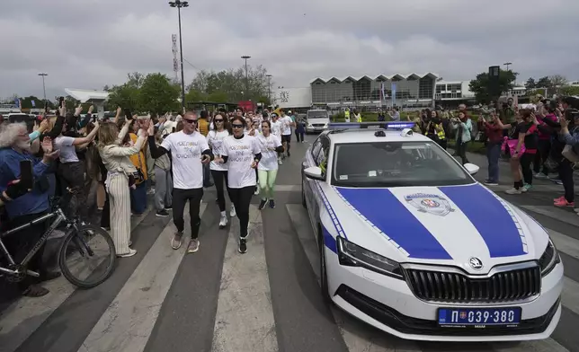 Serbia's protesting students embark on 2,000-kilometer (1,200-mile) run to Brussels aimed to draw European Union attention to their months-long struggle against corruption and for the rule of law in Novi Sad, Serbia, Friday, April 25, 2025. (AP Photo/Darko Vojinovic)