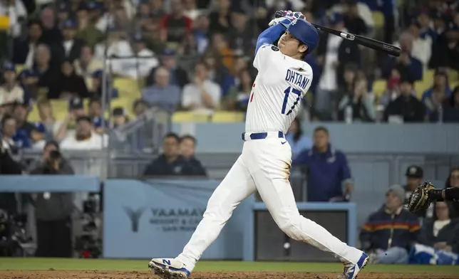 Los Angeles Dodgers' Shohei Ohtani bats during the fifth inning of a baseball game against the Miami Marlins in Los Angeles, Tuesday, April 29, 2025. (AP Photo/Kyusung Gong)