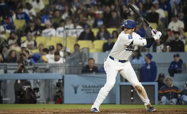 Los Angeles Dodgers' Shohei Ohtani bats during the seventh inning of a baseball game against the Miami Marlins in Los Angeles, Tuesday, April 29, 2025. (AP Photo/Kyusung Gong)