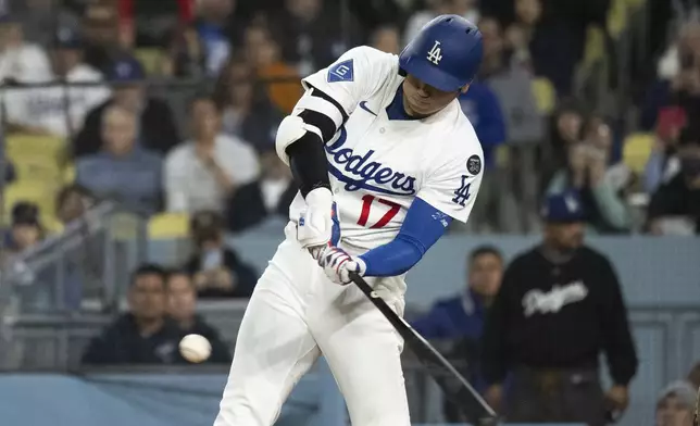 Los Angeles Dodgers' Shohei Ohtani bats during the fifth inning of a baseball game against the Miami Marlins in Los Angeles, Tuesday, April 29, 2025. (AP Photo/Kyusung Gong)