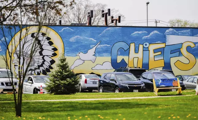 A mural adorns a wall next to the Massapequa High School, in Massapequa, N.Y., Friday, April 25, 2025. (AP Photo/Julia Demaree Nikhinson)
