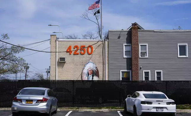 An image of an Indian adorns the facade of the Big Chief Lewis Building, in Massapequa, N.Y., Friday, April 25, 2025. (AP Photo/Julia Demaree Nikhinson)