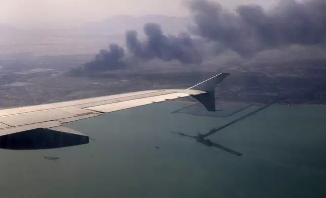 In this photo released by the Iranian Presidency Office, smoke rises in the sky on Sunday, April 27, 2025 after a massive explosion and fire rocked a port near the southern port city of Bandar Abbas, Iran, on Saturday. (Iranian Presidency Office via AP)