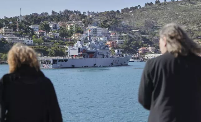 An Italian navy ship approaches the port , as Italian authorities transfer 40 migrants with no permission to remain in the country to Italian-run migration detention centers in Albania, in Shengjin, northwestern Albania, Friday, April 11, 2025. (AP Photo/Vlasov Sulaj)
