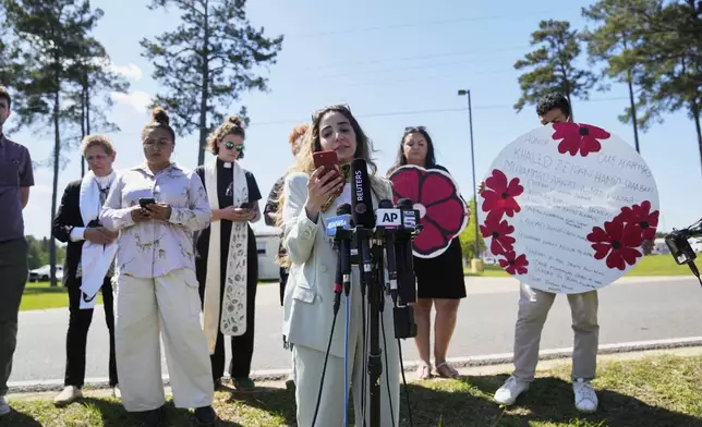 Human rights attorney Sabrine Mohamed reads a message from Mahmoud Khalil, the Columbia University activist facing deportation for his role in pro-Palestinian campus protests, after his immigration hearing, outside the Central Louisiana Ice Processing Center in Jena, La., Friday, April 11, 2025. (AP Photo/Gerald Herbert)