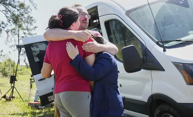Supporters hug outside the Central Louisiana Ice Processing Center in Jena, La., after an immigration hearing for Mahmoud Khalil, the Columbia University activist facing deportation for his role in pro-Palestinian campus protests, Friday, April 11, 2025. (AP Photo/Gerald Herbert)