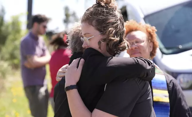 Clergy hug outside the Central Louisiana ICE Processing Center in Jena, La., after an immigration hearing for Mahmoud Khalil, the Columbia University activist facing deportation for his role in pro-Palestinian campus protests, Friday, April 11, 2025. (AP Photo/Gerald Herbert)